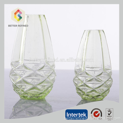 green and white colored glass vase